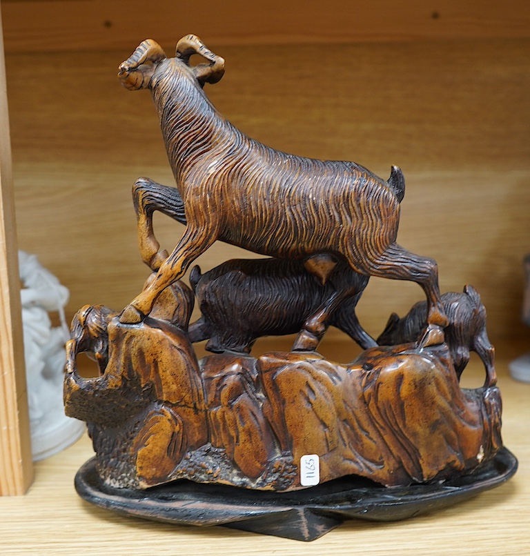 A Chinese carved soapstone figure group of goats on hardwood base, 24cm. Condition - fair to good